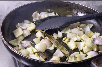 frying the onions with spices