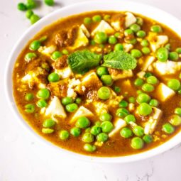 A bowl filled with Matar Paneer