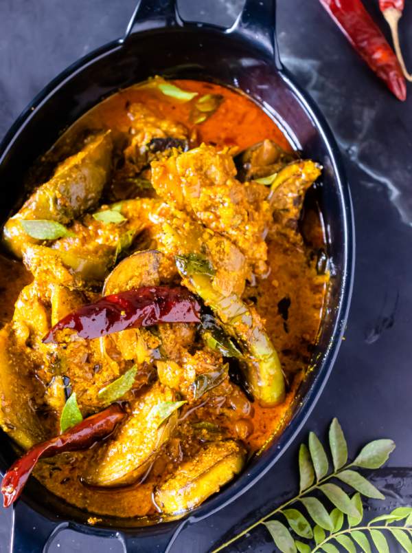 Bengali Dahi Baingan Recipe overhead shot with curry leaves in the bottom right