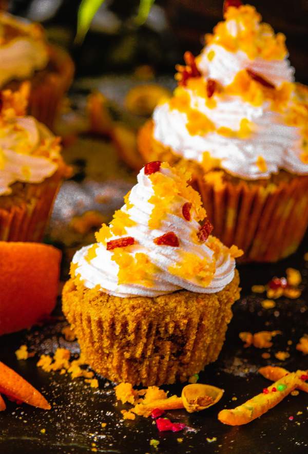 Orange Cranberry Cupcakes on a black table