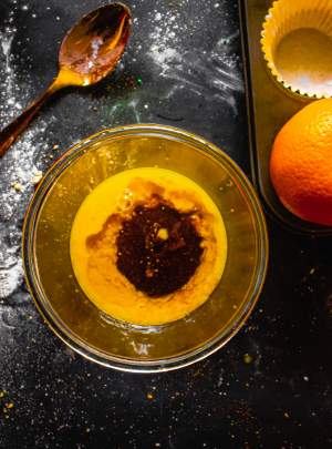 wet ingredients for Orange Cranberry Cupcakes in a bowl