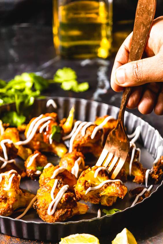 picking out tandoori gobi with fork