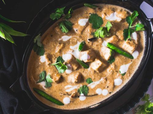 White Reshmi Paneer Recipe in a black bowl