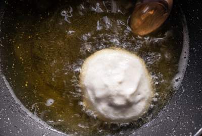 frying dahi bhalla